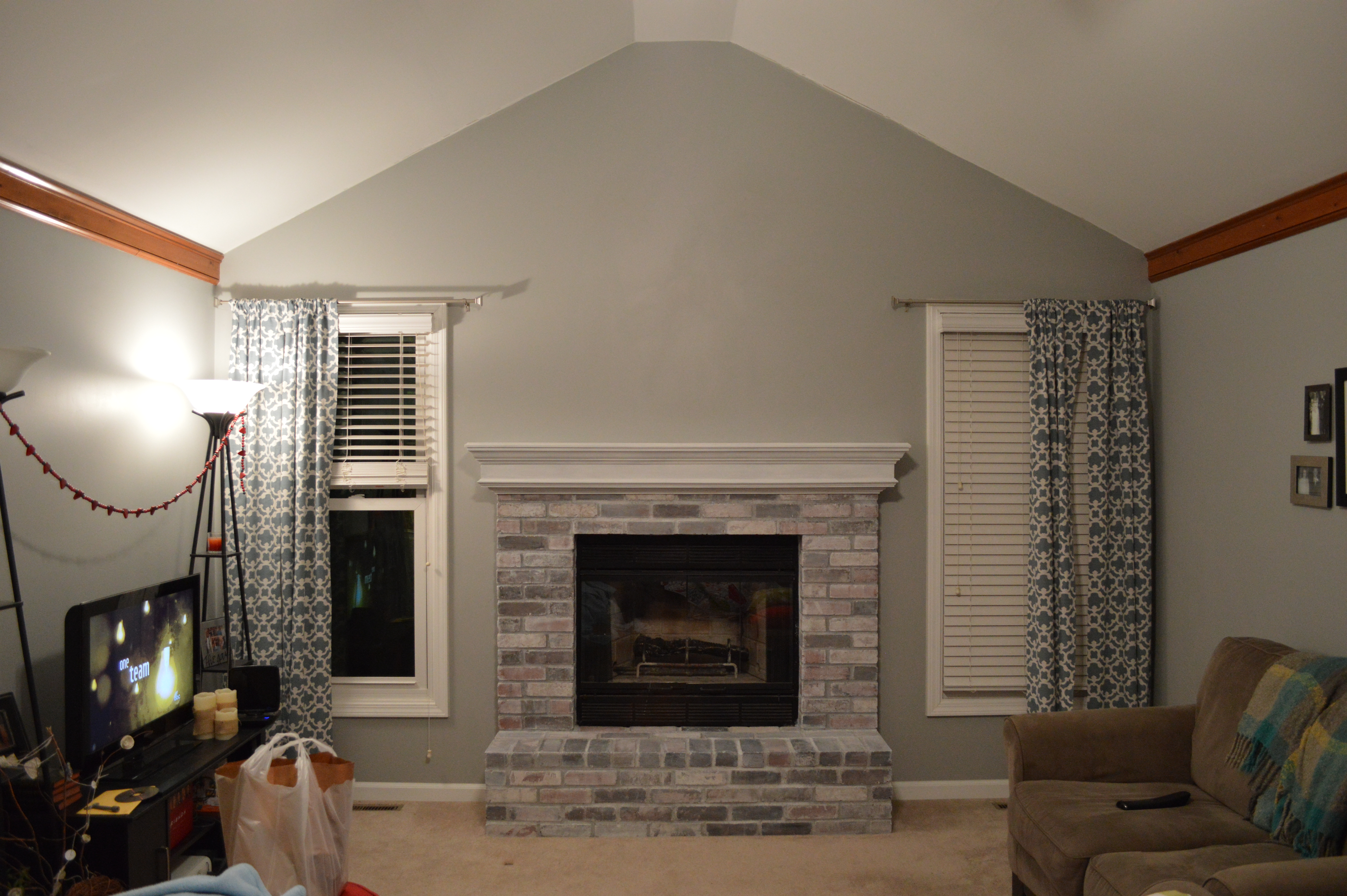The ultimate step-by-step tutorial for how to whitewash brick and transform a dated fireplace with an easy