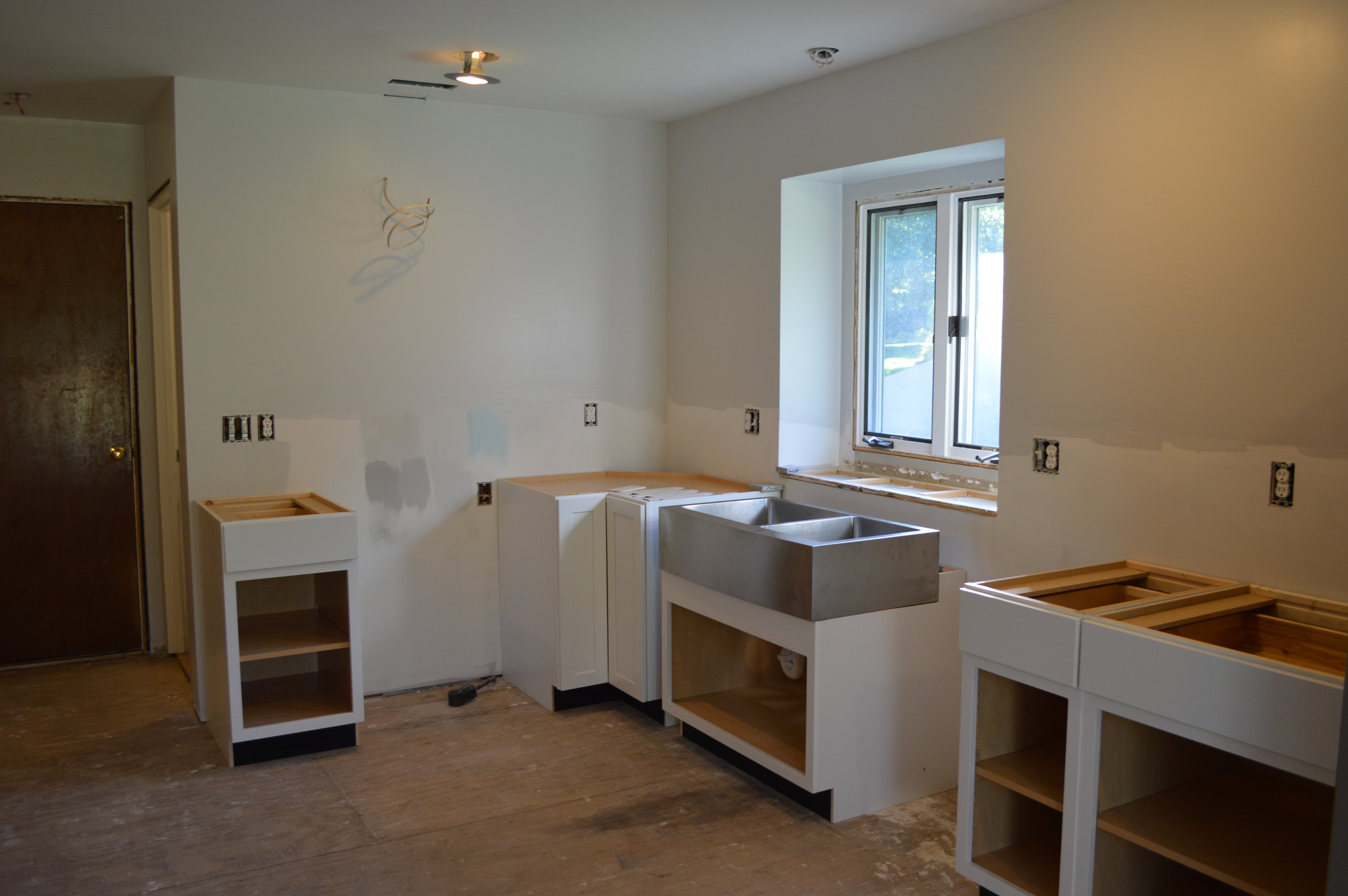 http://lovinghere.com/wp-content/uploads/2014/07/Installing-Kitchen-Base-Cabinets.jpg