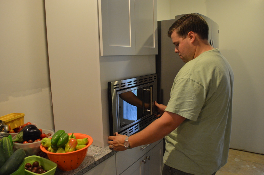 Customizing and hanging the Microwave Cabinet - Loving Here