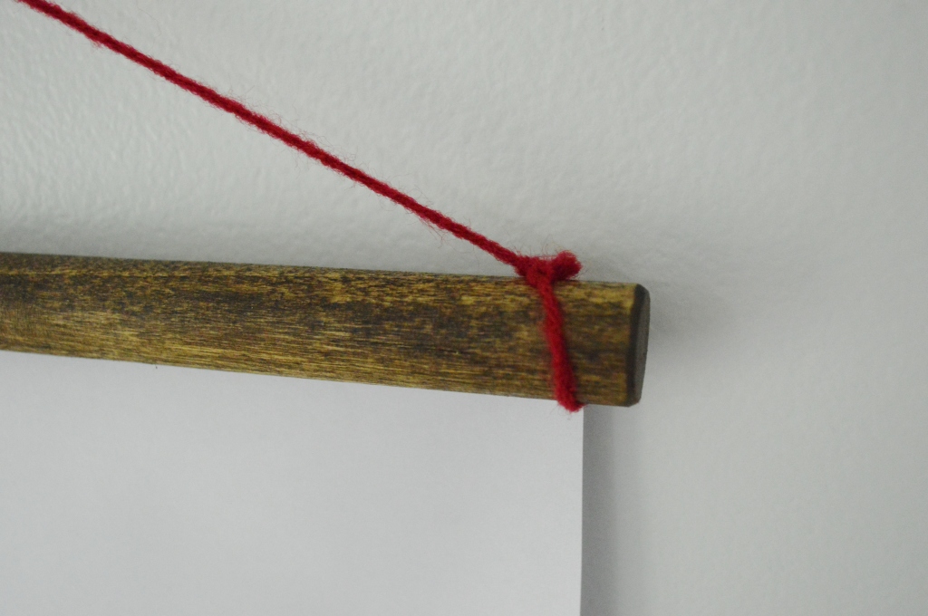 winter wall hanging with dowel rods and yarn