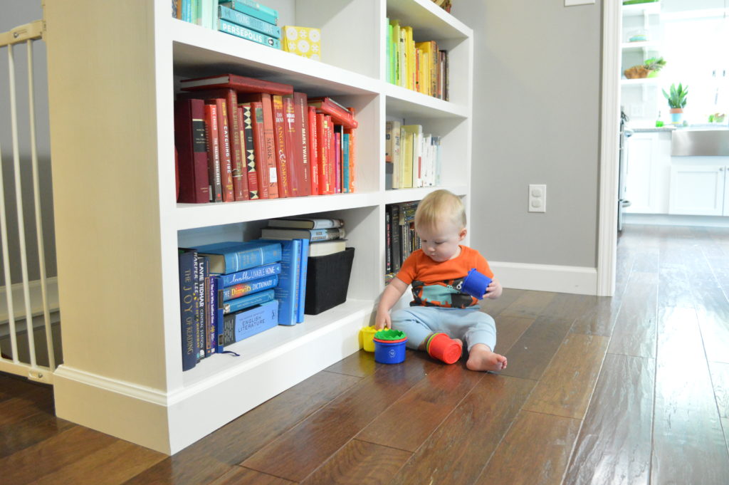 Toy storage in living room with built in bookshelves Will playing with cups